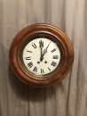Antique wall clock from a shop or brasserie.