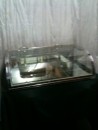 Chromed brass and curved glass flat display case