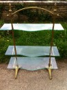 Brass and glass shelves display