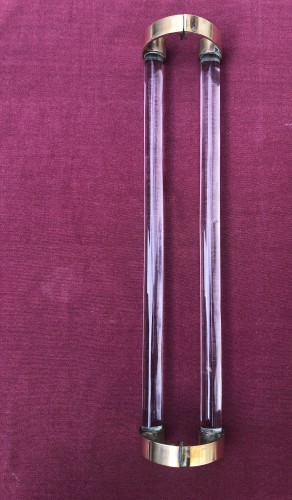Two old pairs of door handles from a luxury store