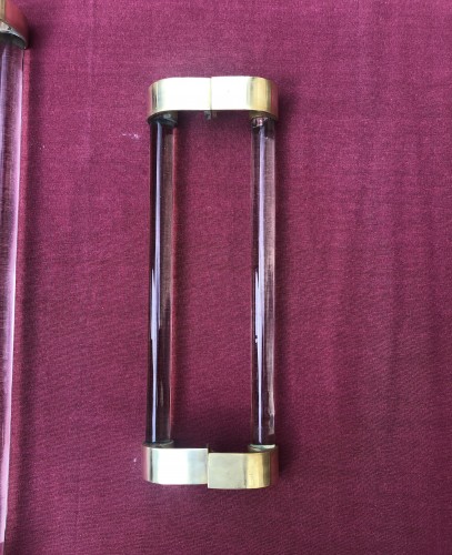 Two old pairs of door handles from a luxury store