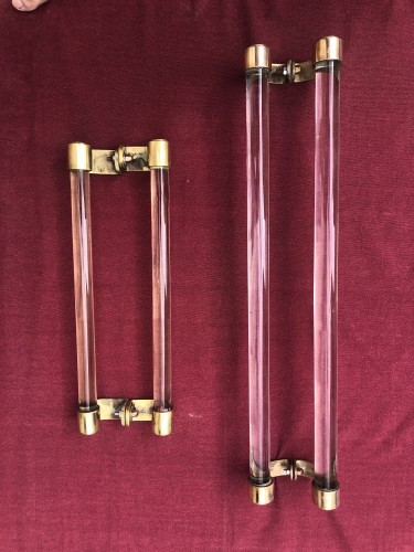 Two old pairs of door handles from a luxury store