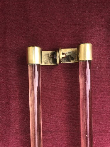 Two old pairs of door handles from a luxury store