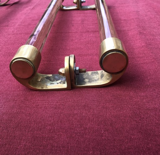 Two old pairs of door handles from a luxury store
