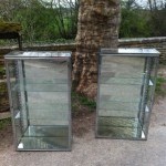 Pair of chromed display cases
