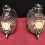 Two old shop perfume barrels.