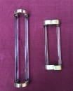 Two old pairs of door handles from a luxury store