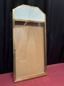 Antique wall-mounted jewelry display case.