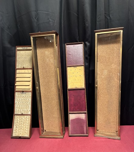 Pair of antique wall-mounted jewelry display cases.