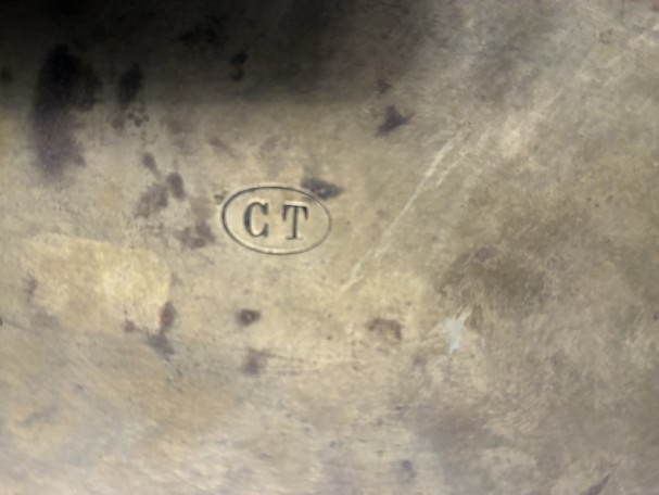 Antique brass shop sign.