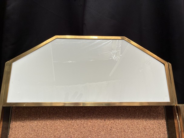 Antique wall-mounted jewelry display case.