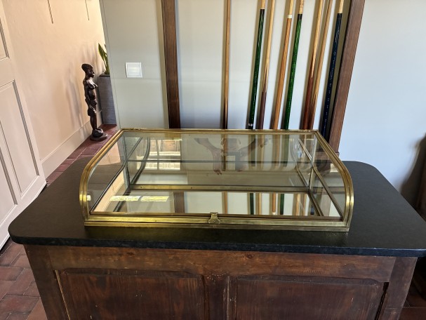 Antique shop counter display case.