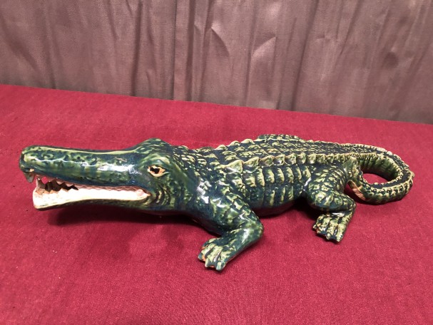 Old large earthenware crocodile.