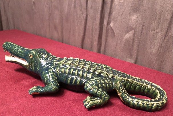Old large earthenware crocodile.