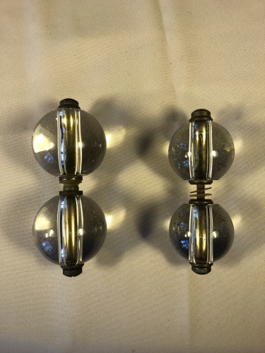 Two pairs of old shop door handles.