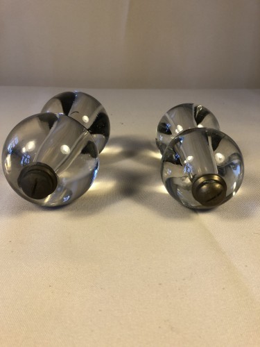 Two pairs of old shop door handles.