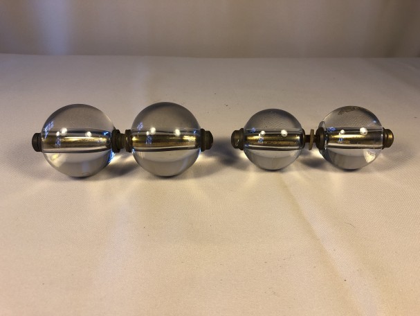Two pairs of old shop door handles.