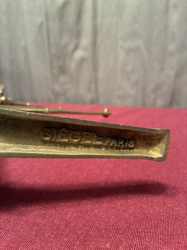 A collection of old shop shelf brackets.