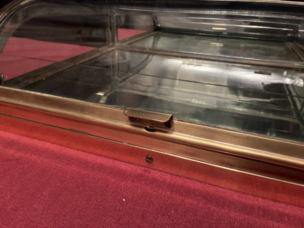 Small antique shop counter display case.