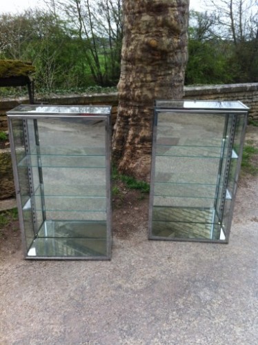 Pair of chromed display cases