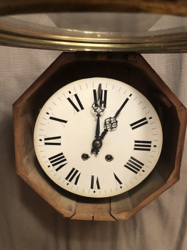 Antique wall clock from a shop or brasserie.