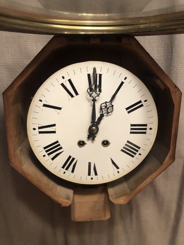 Antique wall clock from a shop or brasserie.