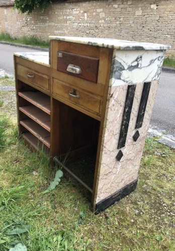 Former cash register and store presentation furniture.