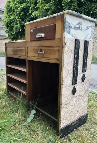 Former cash register and store presentation furniture.