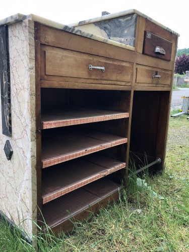 Former cash register and store presentation furniture.