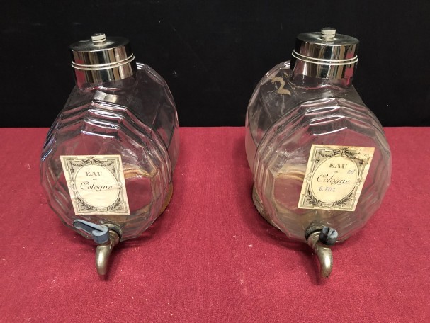 Two old shop perfume barrels.