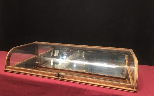 Old curved counter display case.