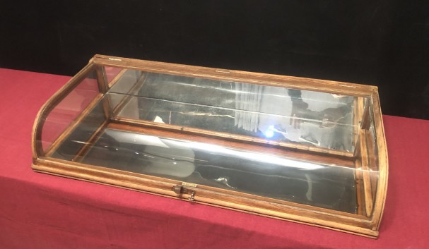 Old curved counter display case.