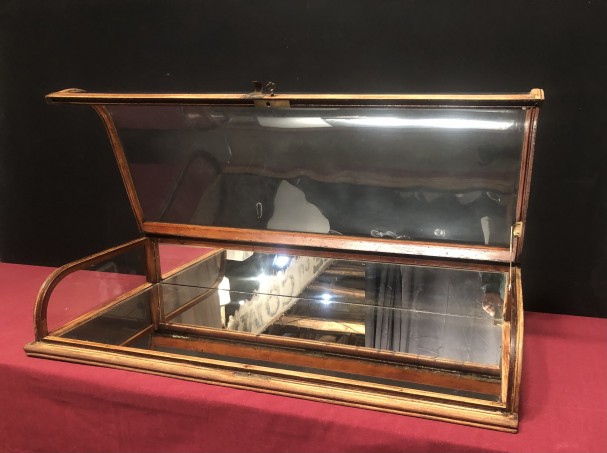 Old curved counter display case.