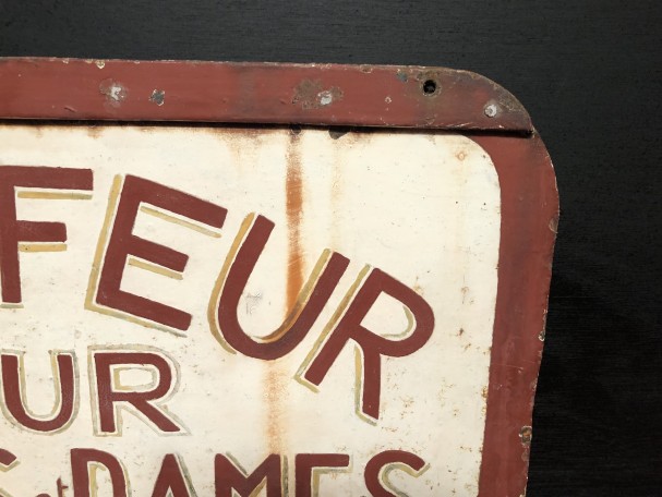 Old street sign. Hairdresser.