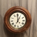 Antique wall clock from a shop or brasserie.