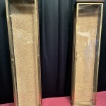Pair of antique wall-mounted jewelry display cases.