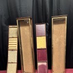 Pair of antique wall-mounted jewelry display cases.