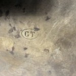 Antique brass shop sign.