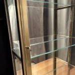 Small antique wall-mounted display case.