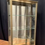 Small antique wall-mounted display case.
