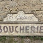 Former large shopfront sign.