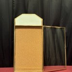 Antique wall-mounted jewelry display case.