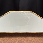 Antique wall-mounted jewelry display case.