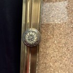 Antique wall-mounted jewelry display case.