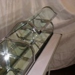 Triple flat chrome vitrine, curved glass