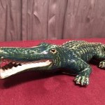 Old large earthenware crocodile.