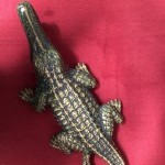 Old large earthenware crocodile.