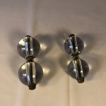 Two pairs of old shop door handles.