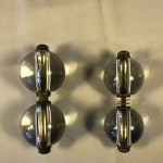 Two pairs of old shop door handles.