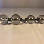 Two pairs of old shop door handles.